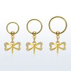 gold steel ball closure ring 16g w dangling dragonfly