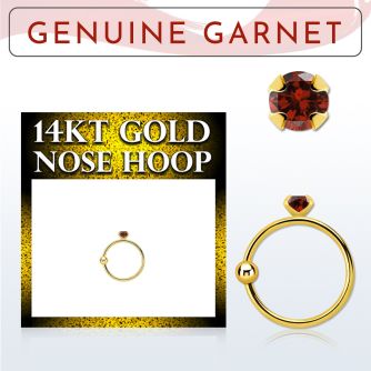 ghge2 14kt gold nose hoop w a 2mm prong set garnet stone